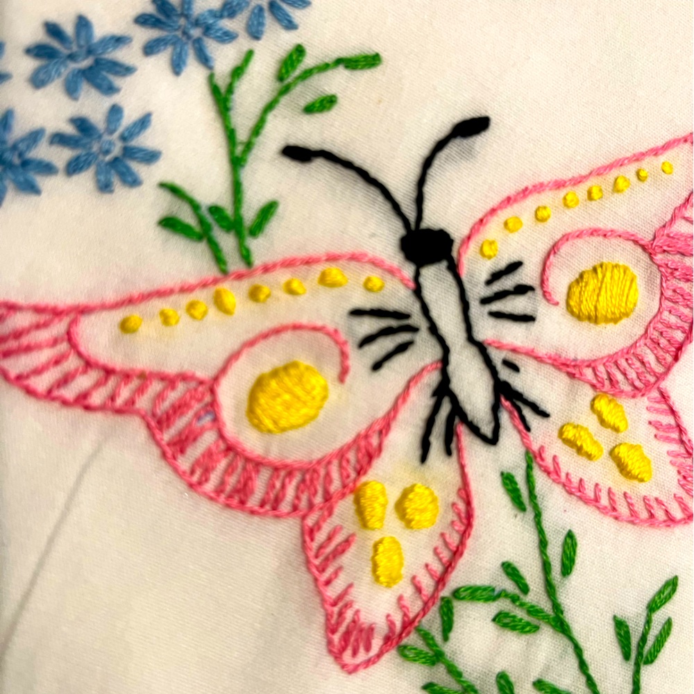 Hand stitched embroidered butterfly motif on standard size pillow case